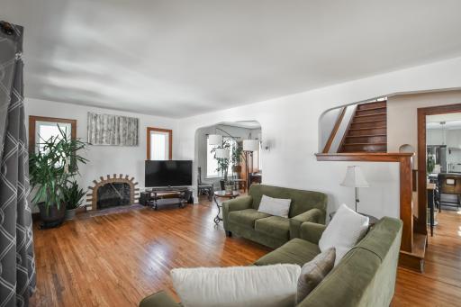 You're greated by the charm of the decorative fireplace, arched dining room, gorgoues original floors and practicality of new windows.