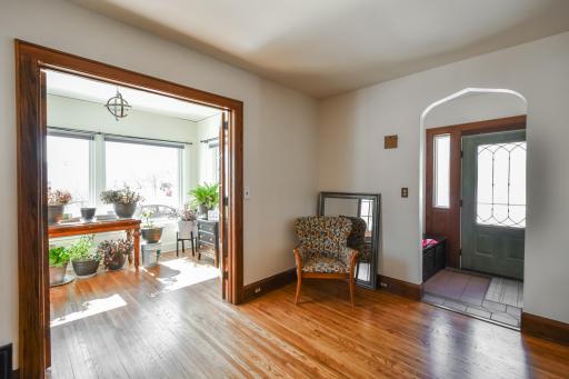 The sunroom with it's french doors and wall of new windows lets and all the natural light! Floors have been redone. Added top up/bottom down blinds to the sunroom. Southern Exposure!