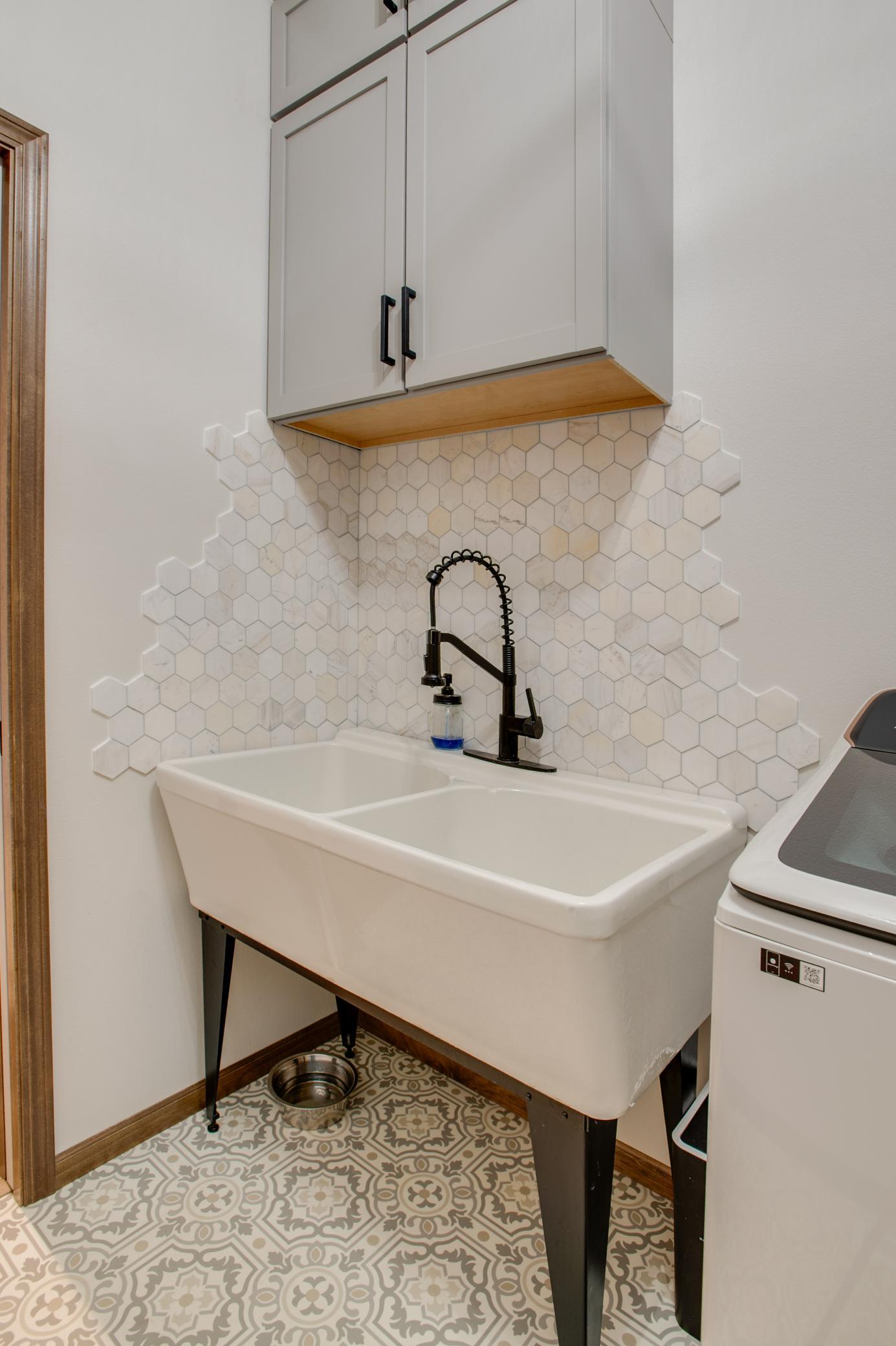 Custom vintage cast iron sink and backsplash