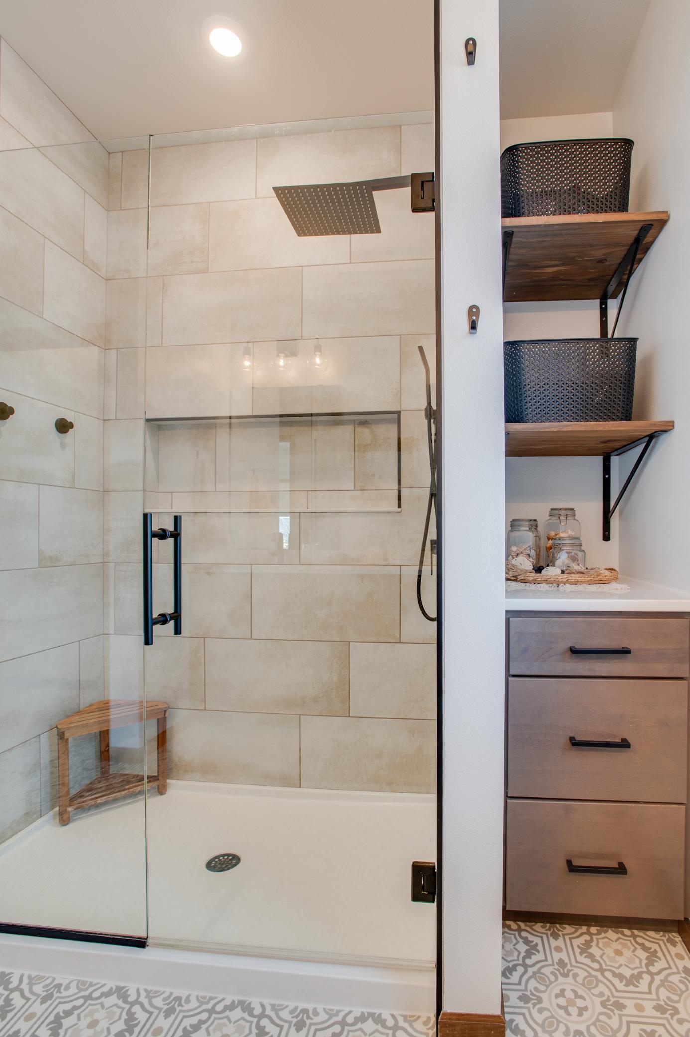 Walk in tiled shower & custom built in