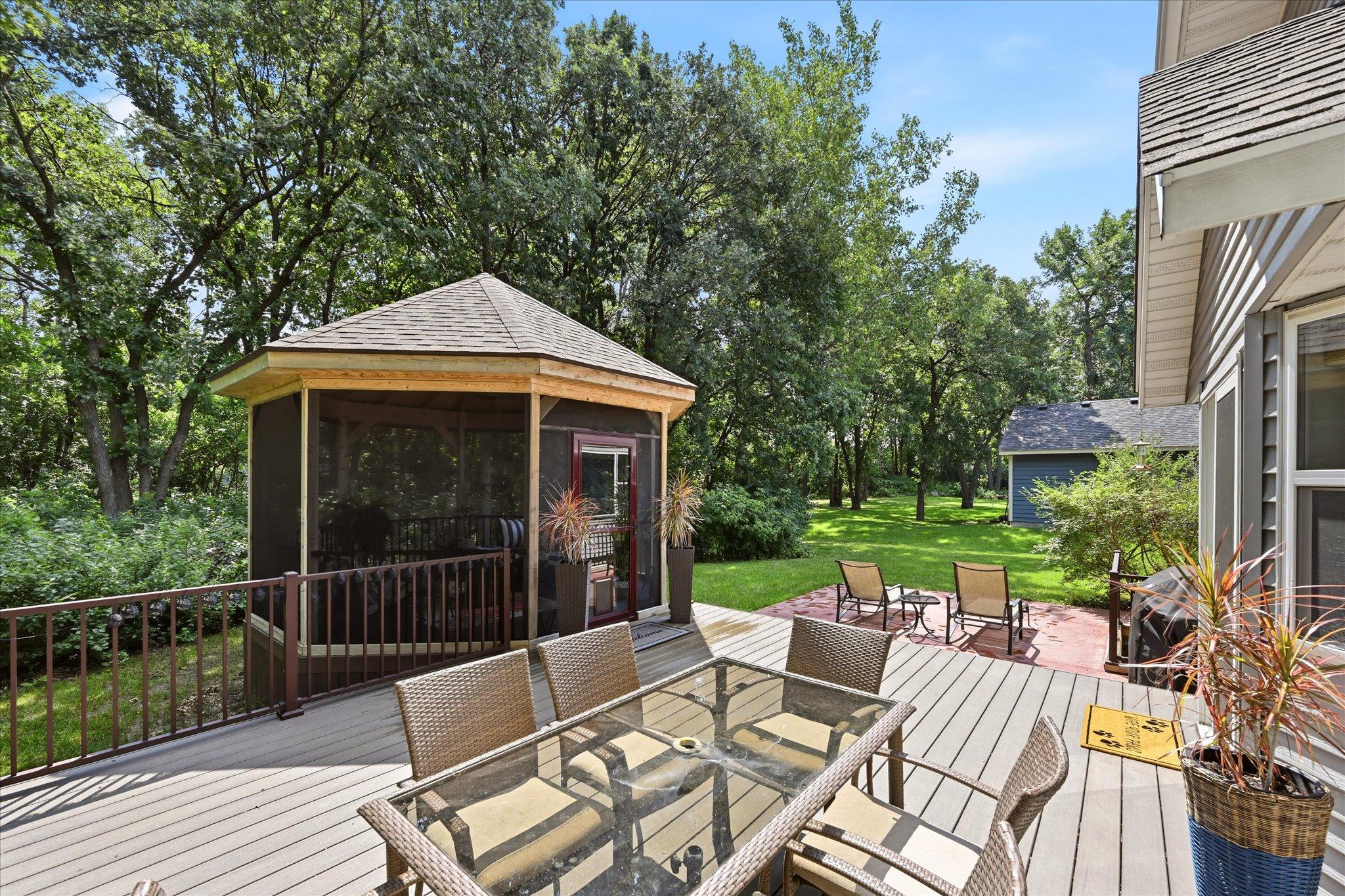 Maintenance-free deck, stamped patio, and screened gazebo create exceptional outdoor living spaces