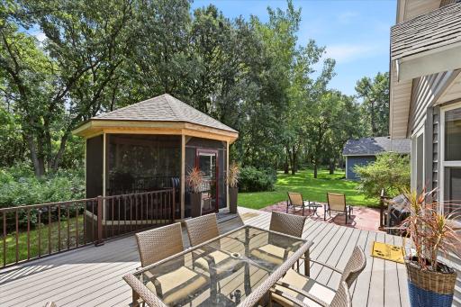Maintenance-free deck, stamped patio, and screened gazebo create exceptional outdoor living spaces