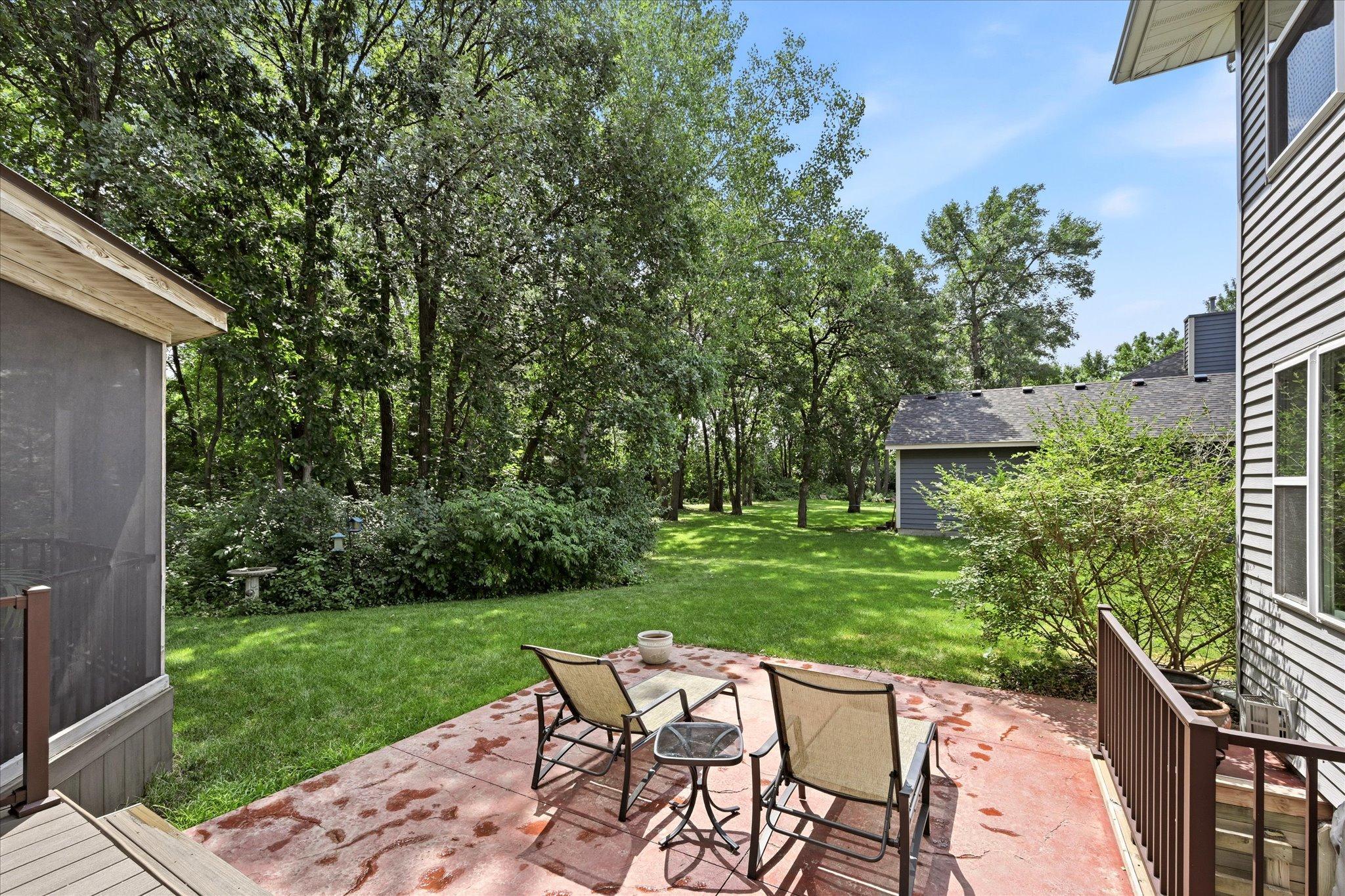Mature trees provide seasonal privacy and a picturesque setting