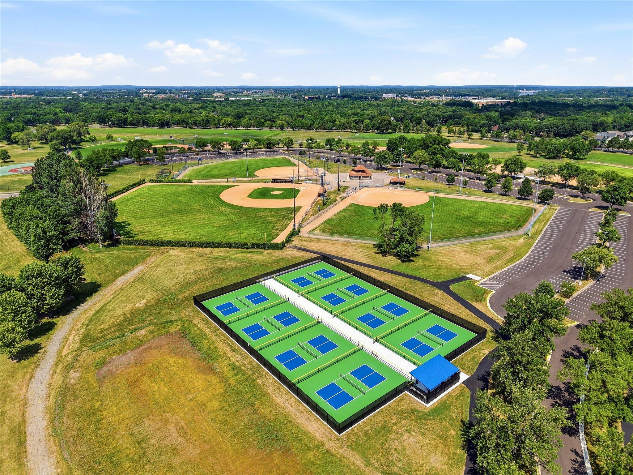 Nearby walking trails, pickleball courts, and neighborhood amenities enhance everyday living