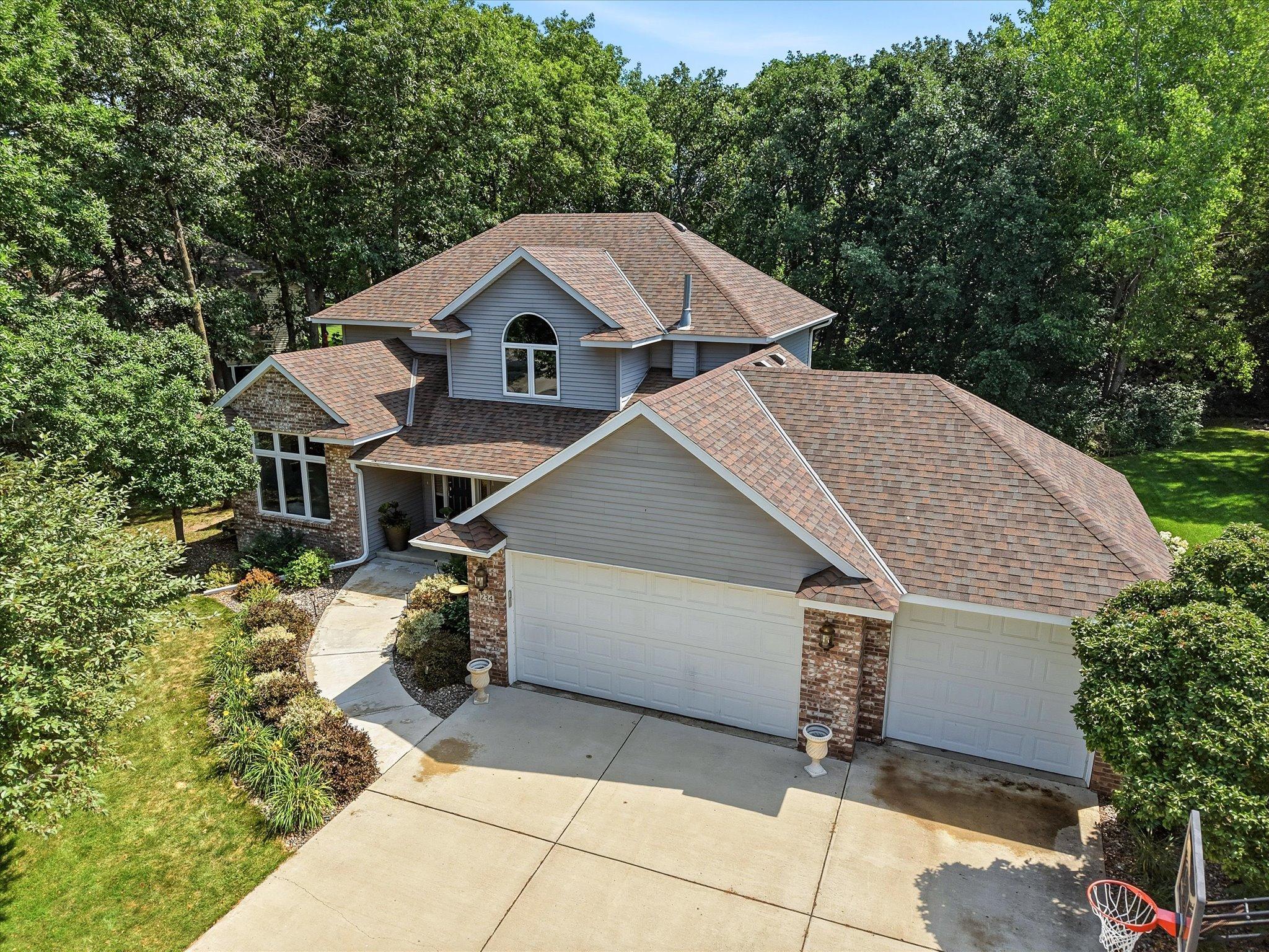 Spacious 3-car garage offers room for vehicles, storage, and hobbies