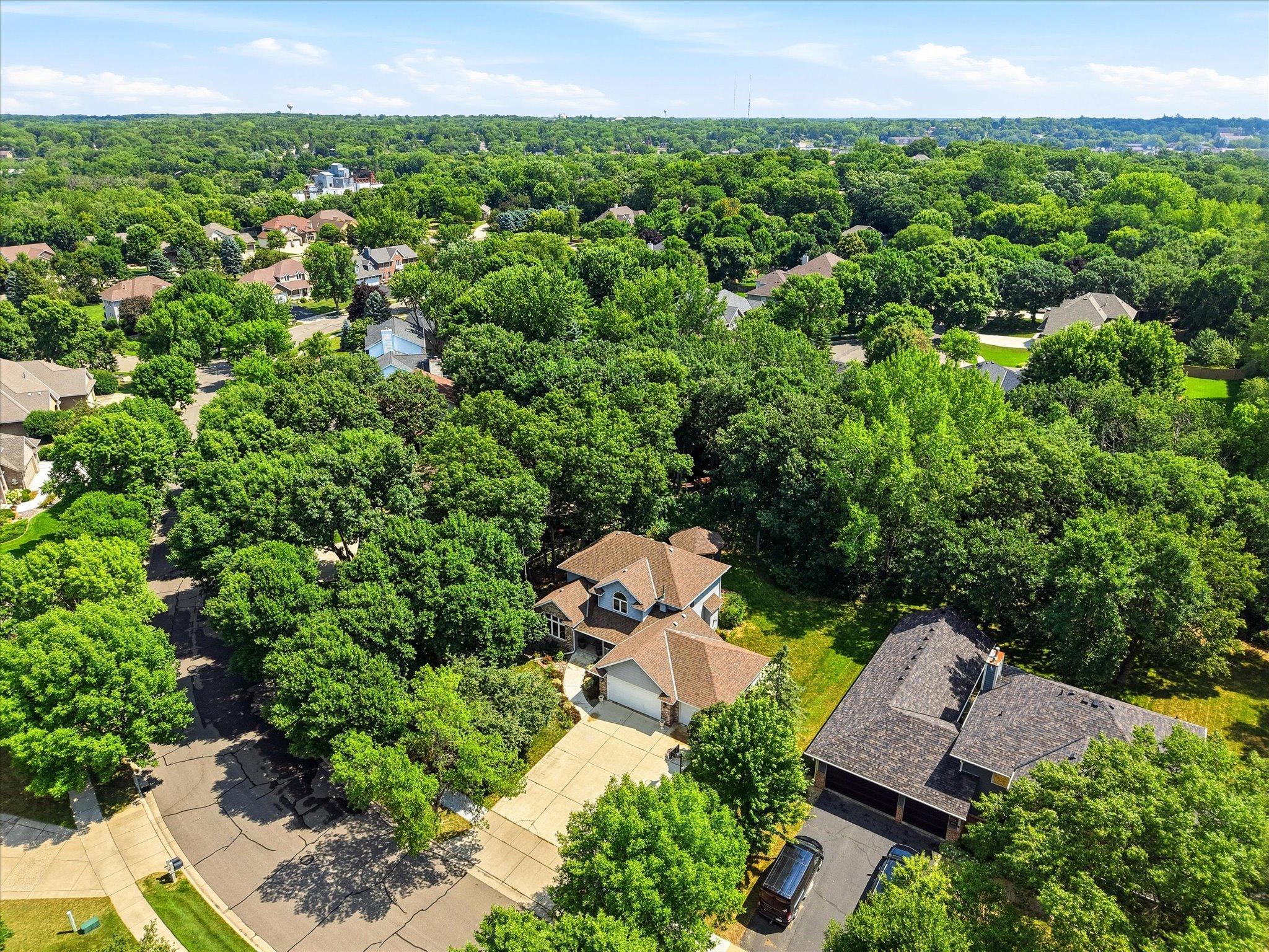 Private wooded backyard offers peaceful views and frequent wildlife sightings