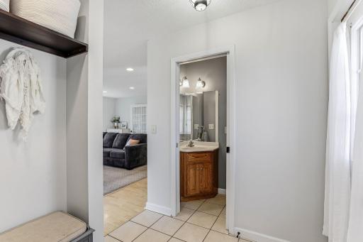 Main level half bath with modern fixtures, a sleek vanity, and stylish finishesâdesigned for convenience and guest use.
