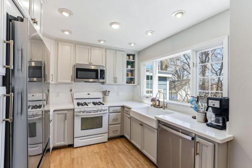 Expansive kitchen window fills the space with natural light while offering views of the backyard. Perfectly positioned above the sink, this large window creates a bright, inviting atmosphere.