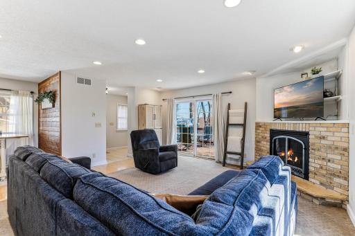 Gas fireplace adds warmth and ambiance to the heart of the home.