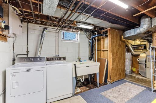 Generous utility area with open floor space and convenient access to home systems.