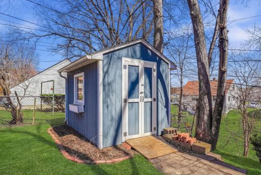 Detached storage shed ideal for yard tools, hobbies, or extra gear.