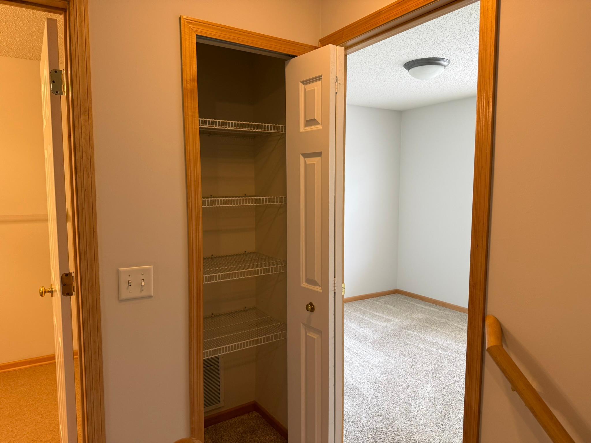 Linen closet in upper loft. Lots of storage space in this home!