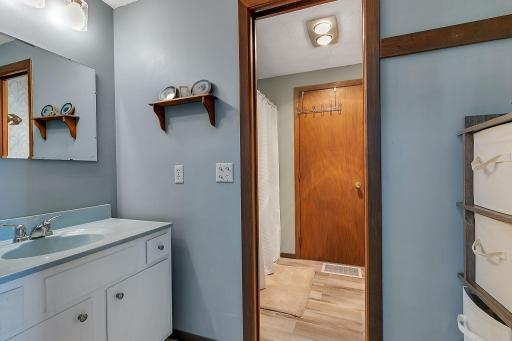 Main level bath with TWO separate vanities! Morning squabbles are likely to be a thing of the past here.