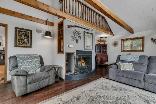 Cozy up by the wood burning fire place on a cool evening.