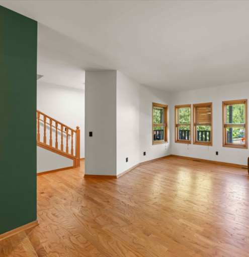 Living room and stair case to upper level.png