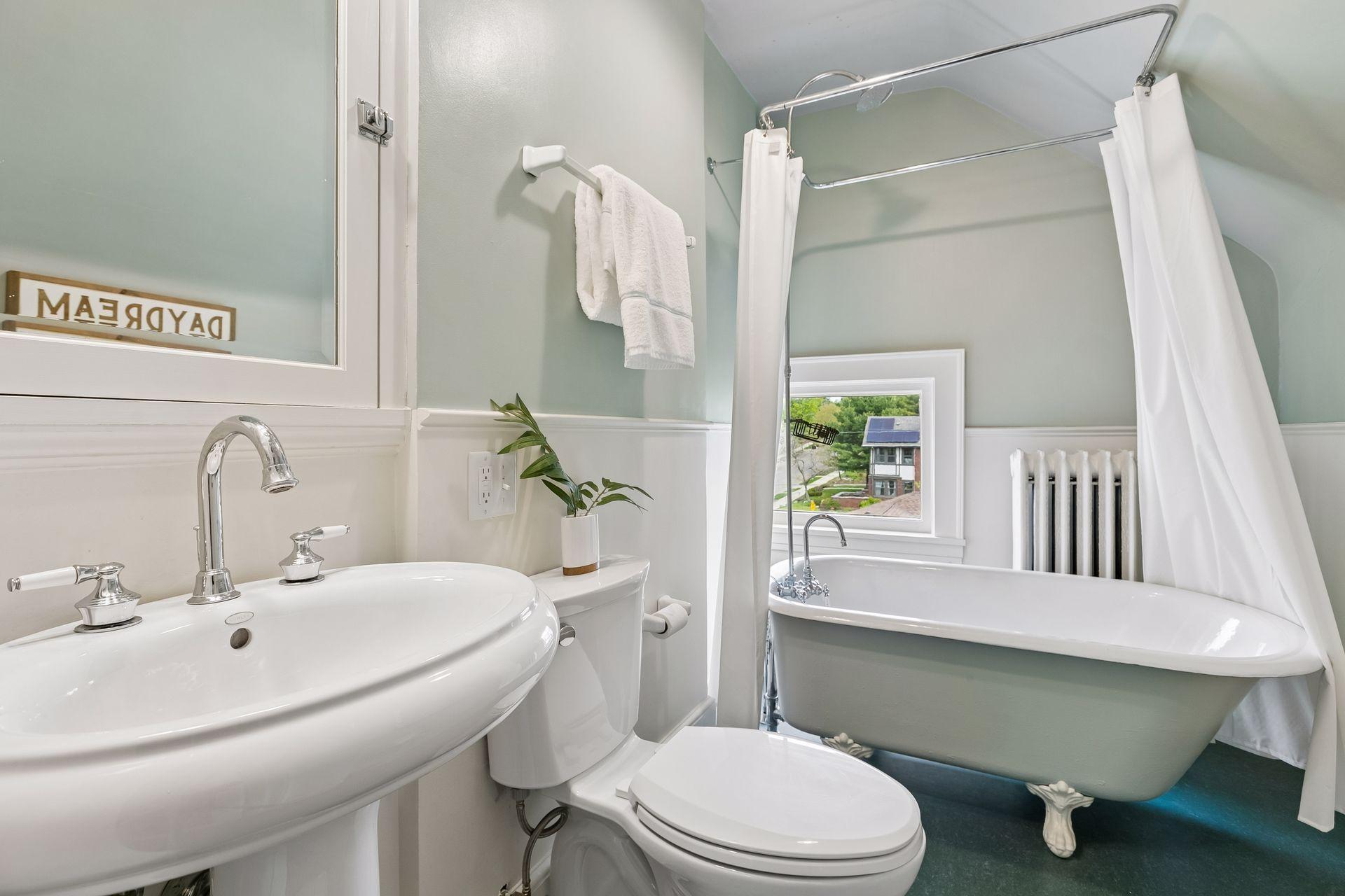 Full bath with original claw foot tub.