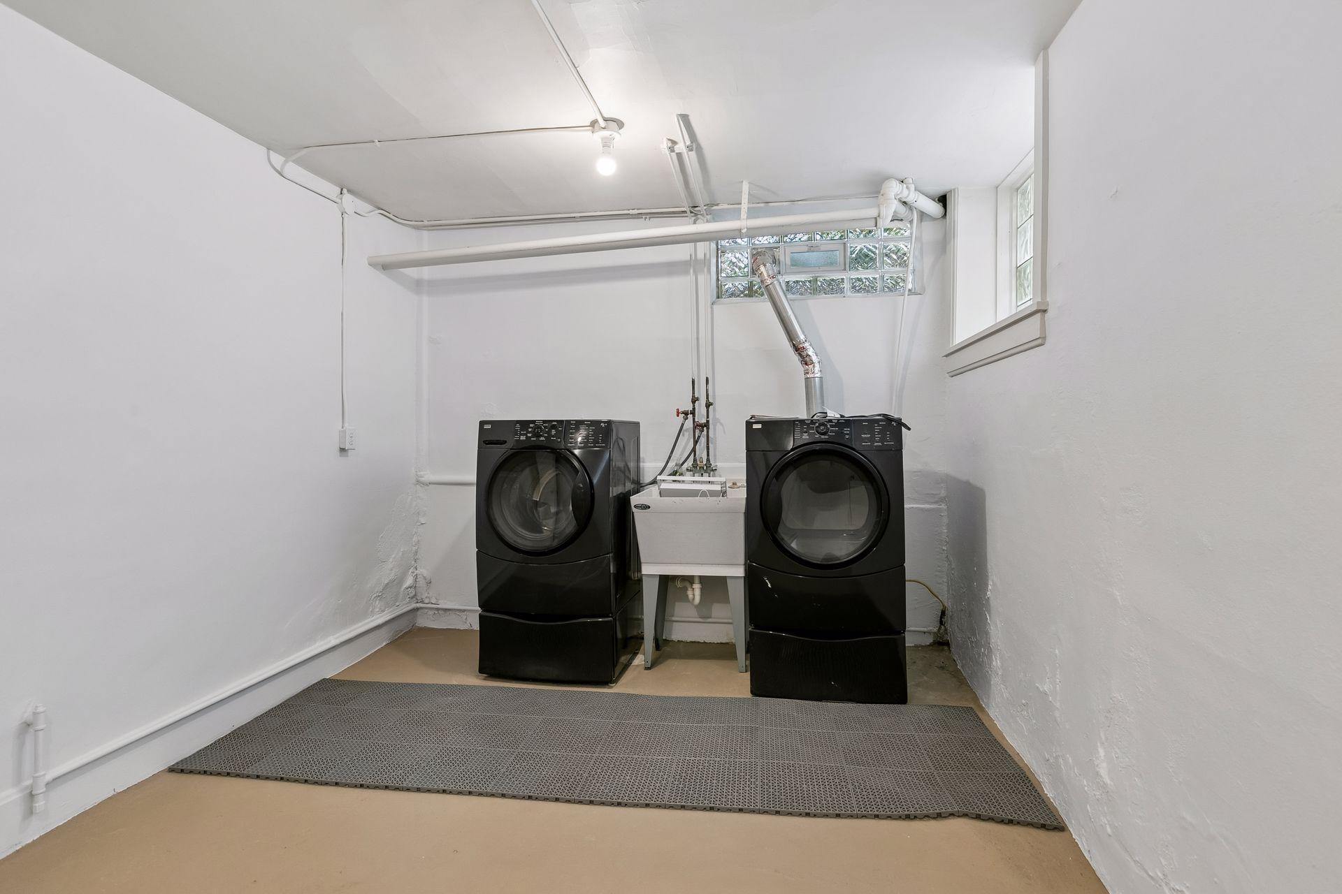 10 x 17 Lower level laundry room. Block glass windows let the sunshine in!