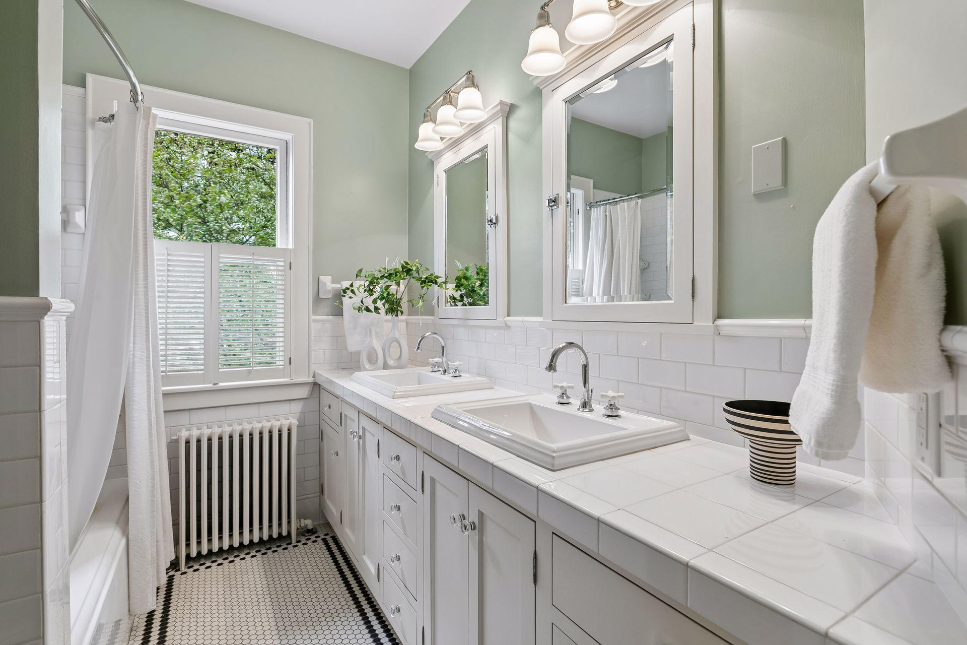 Full bathroom in the hall with double vanities