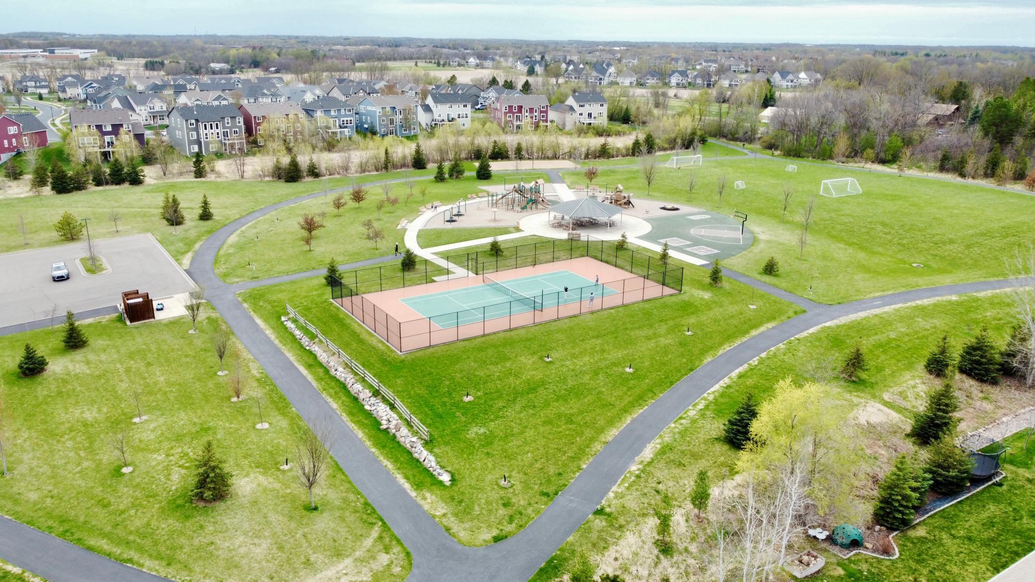 Neighborhood park featuring playground, trails, and open green space just moments from the home