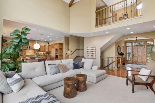 Open expansive living space filled by natural light connects the gourmet kitchen and is perfect for entertaining.