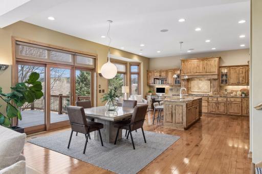 Casual open-concept dining room opening directly onto the spacious outdoor deck