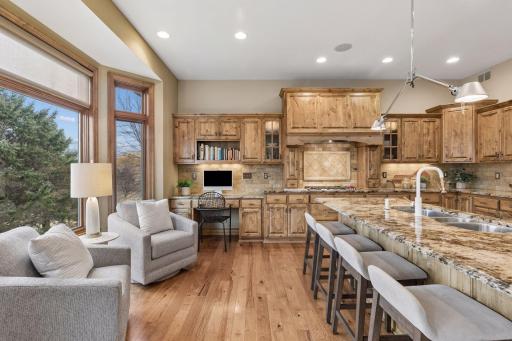 A cozy bay window sitting area overlooks the entire 8 - acre property from the kitchen