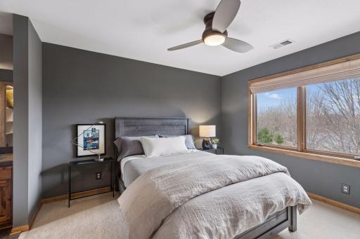 One of the guest rooms on the second level with a rich warm color drench