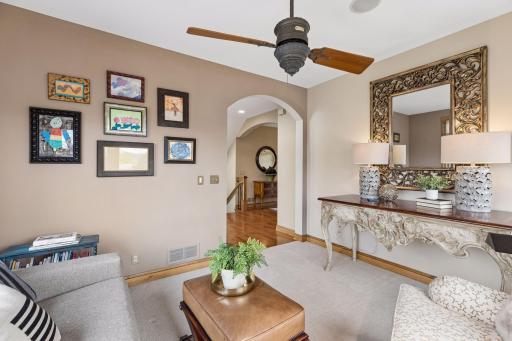 Tucked around the corner of the main level living space, this is a perfect den, TV room or library.