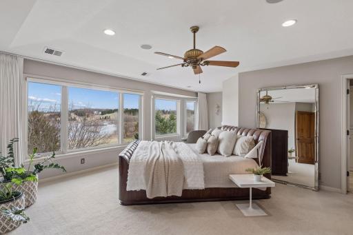 The Luxurious Primary Suite is bathed in incredible natural light with sweeping views for miles.