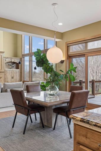 Casual dining space with floor-to-ceiling views of the serene 8- acre retreat.