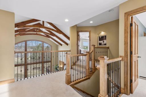 A two story vaulted living space can be experienced from the second floor landing overlooking views for miles.
