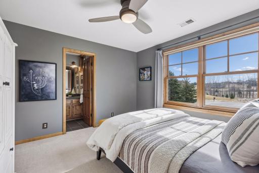 Another well appointed guest suite with a private bath and serene views of the acreage.