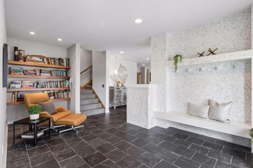 Multiple sitting areas and spots to store pool bags and wet towels is idea.