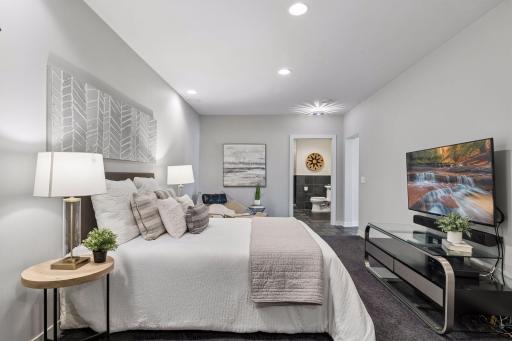 This is a flex space can easily be used as a private guest suite with a large sliding door that leads to the living space and kitchen.