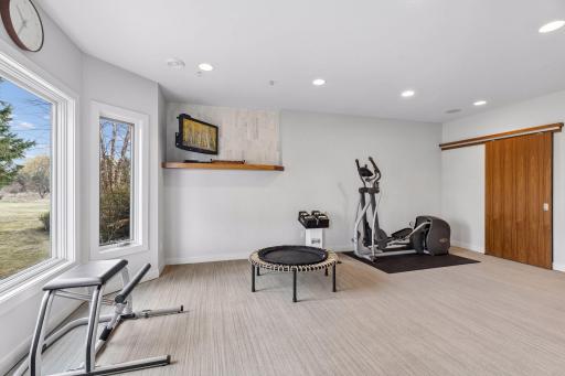 Everyone loves a home gym and this home has one with gorgeous views and natural light!