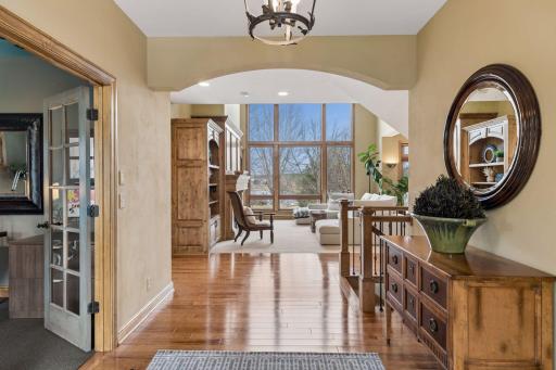 Beautiful Hickory Hardwood Flooring gracefully flows throughout the main level