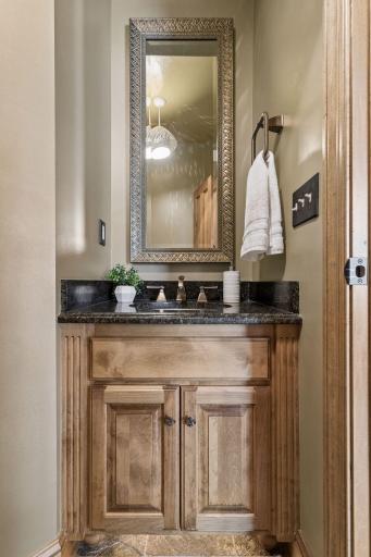Right off the back entry this convenient half bath is perfect for your guests.