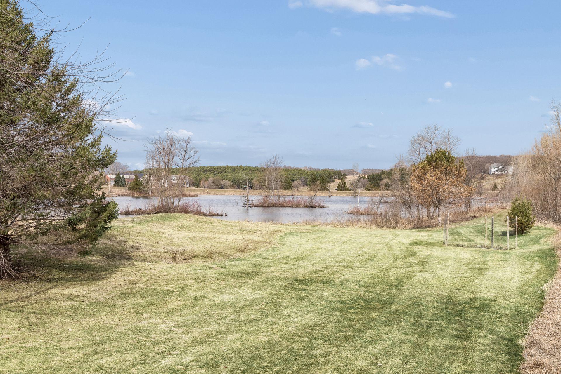A breathtaking expanse of backyard unfolds beyond the home, embraced by towering mature trees creating total seclusion.