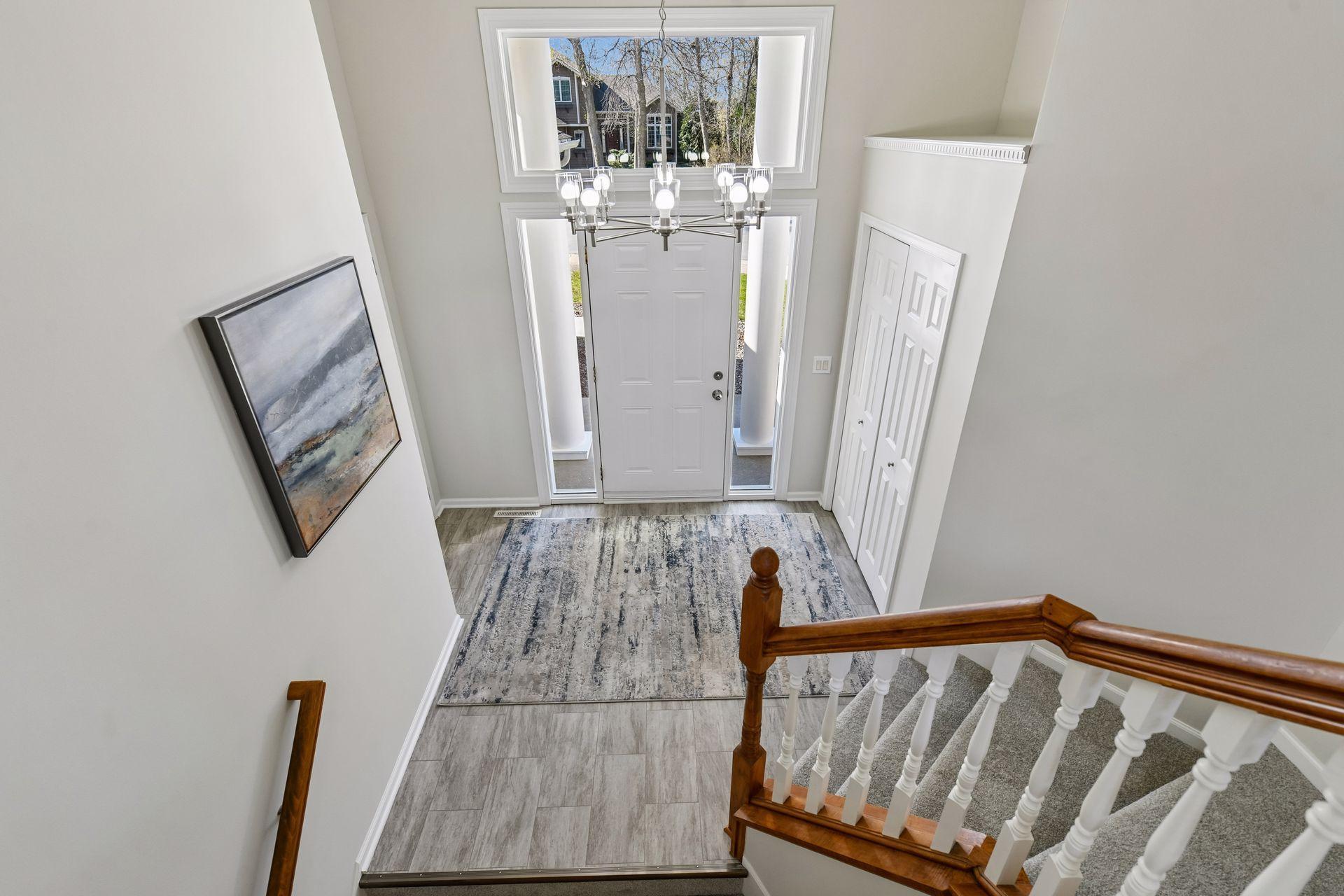 Welcome guests at your front door with nice closet and access to three car heated garage on the left.