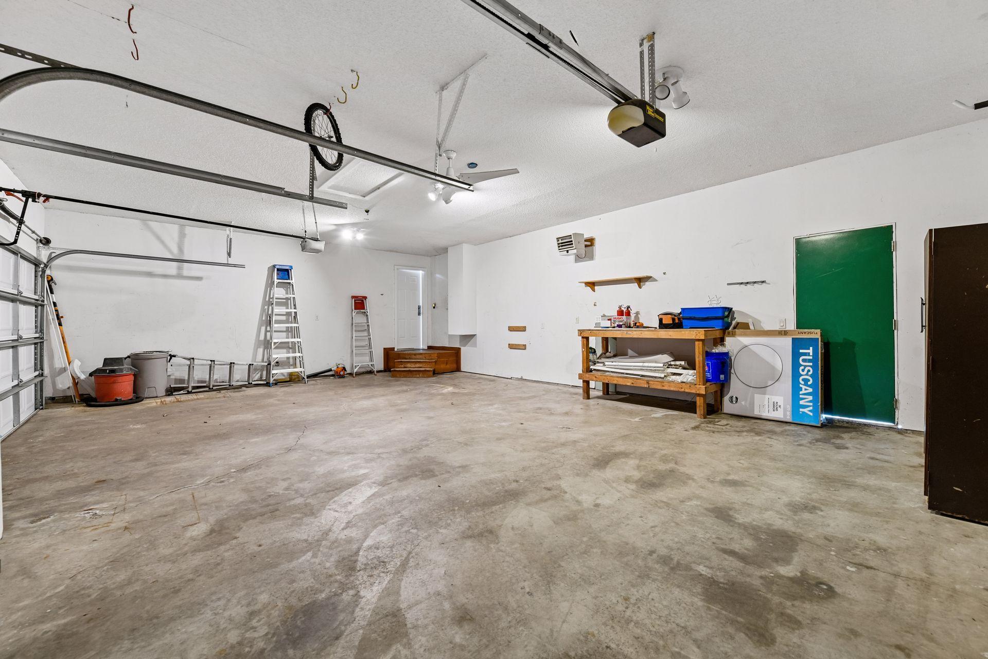 Heated garage 32x23 with back service door to backyard. Also, more storage is available if wanted with ceiling hatch.