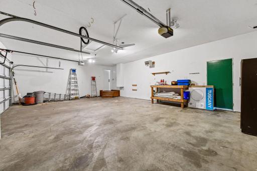 Heated garage 32x23 with back service door to backyard. Also, more storage is available if wanted with ceiling hatch.