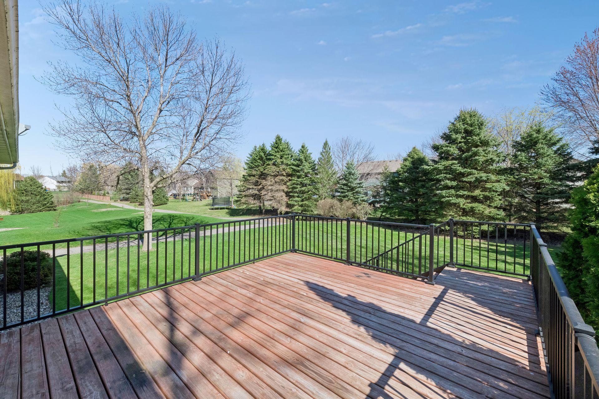 Private backyard oasis awaits. Nice deck with maintenance free railing on .31-acre flat yard connected to paved walking trails for daily exercise or outdoor enjoyment.