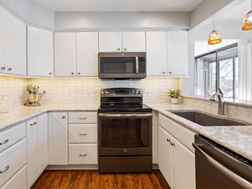 Gorgous, updated kitchen with ample storage, granite counters and stainless appliances.