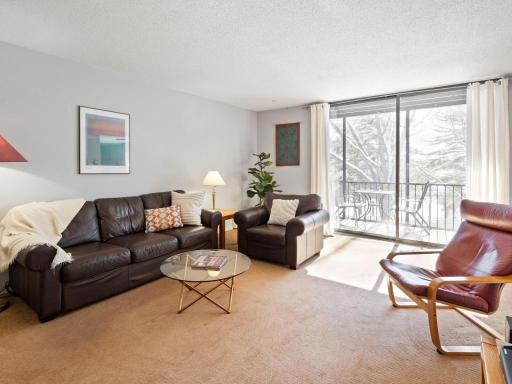 Covered and screened, private balcony off of living room.
