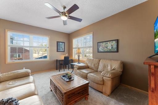 Flexible family room ideal for sitting area, office, or additional living space