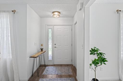 Updated flooring and a new light welcome you home.