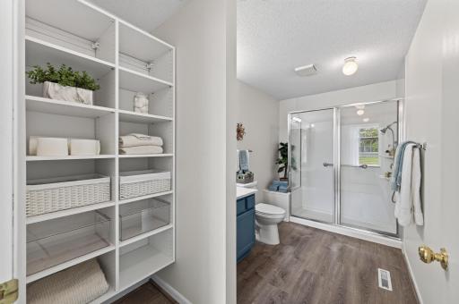 The primary bathroom is spacious and fully updated.
