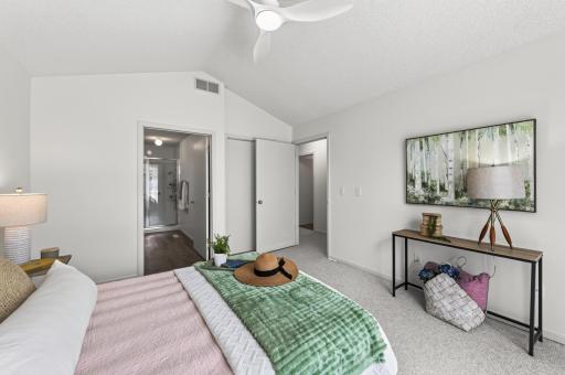 The spacious primary bedroom has a new fan, fresh paint and plenty of space to be a true retreat.