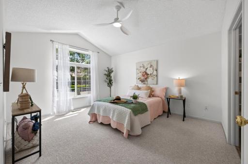 The spacious primary bedroom is a true retreat.