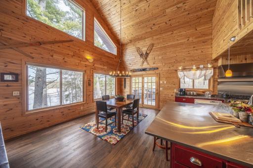 Spacious Dining Area with a wraparound deck just through the French doors.